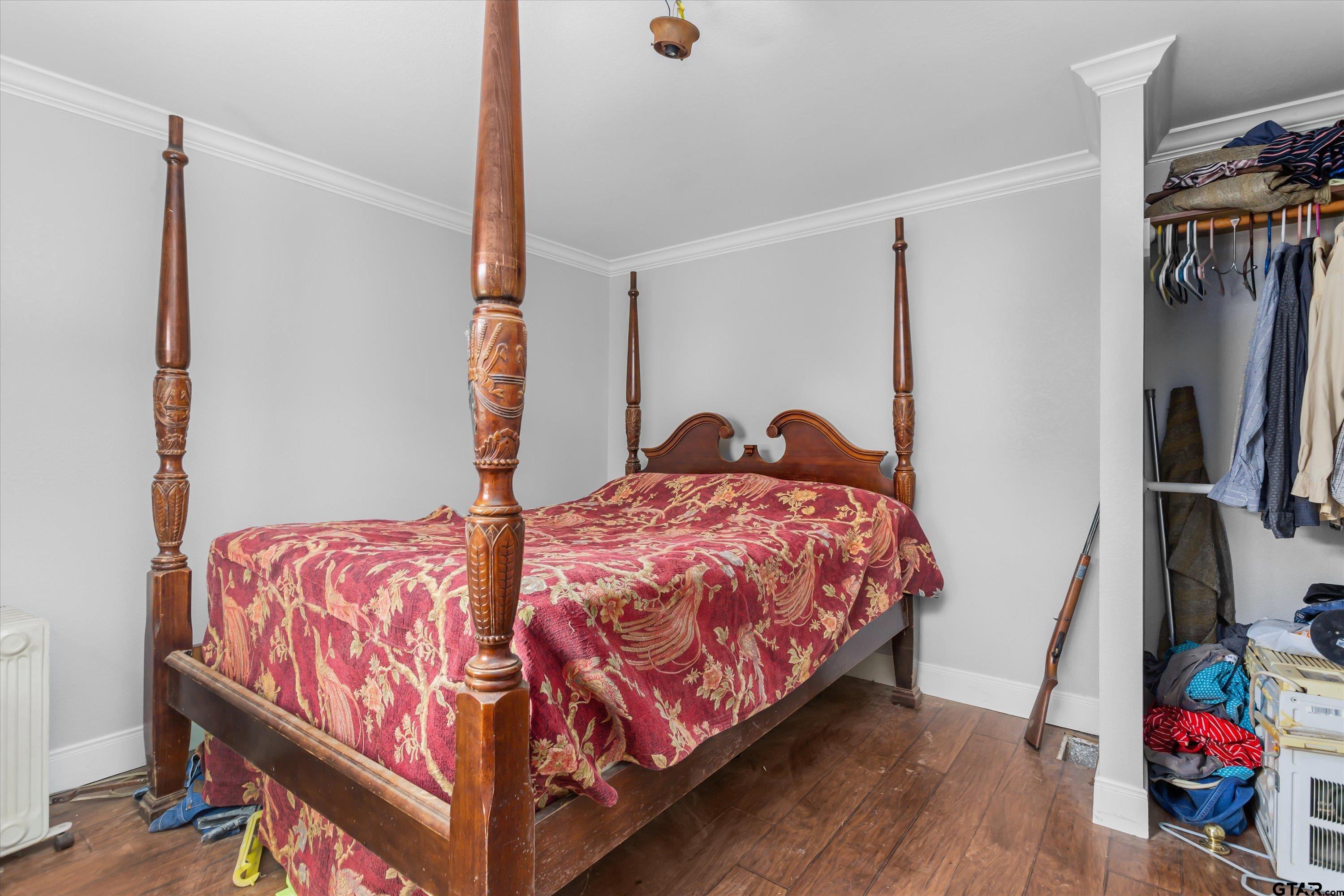 9374 Cedarvale Drive Tyler, TX 75708 - Photo 14 of 20 a bed sitting in a bedroom next to a window