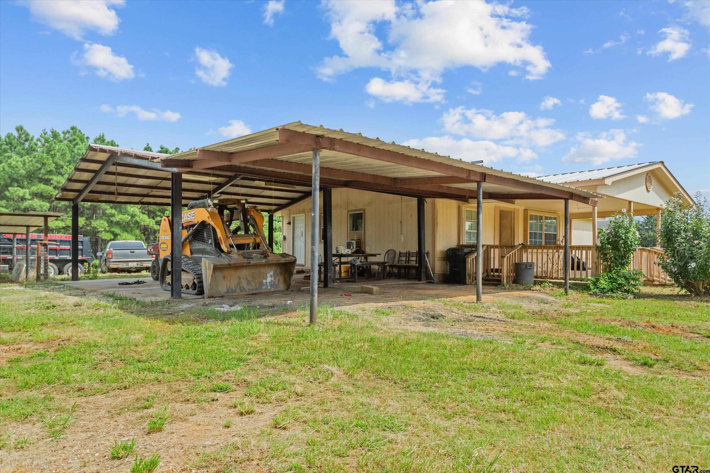 9374 Cedarvale Drive Tyler, TX 75708 - Photo 18 of 20 a view of a house with backyard