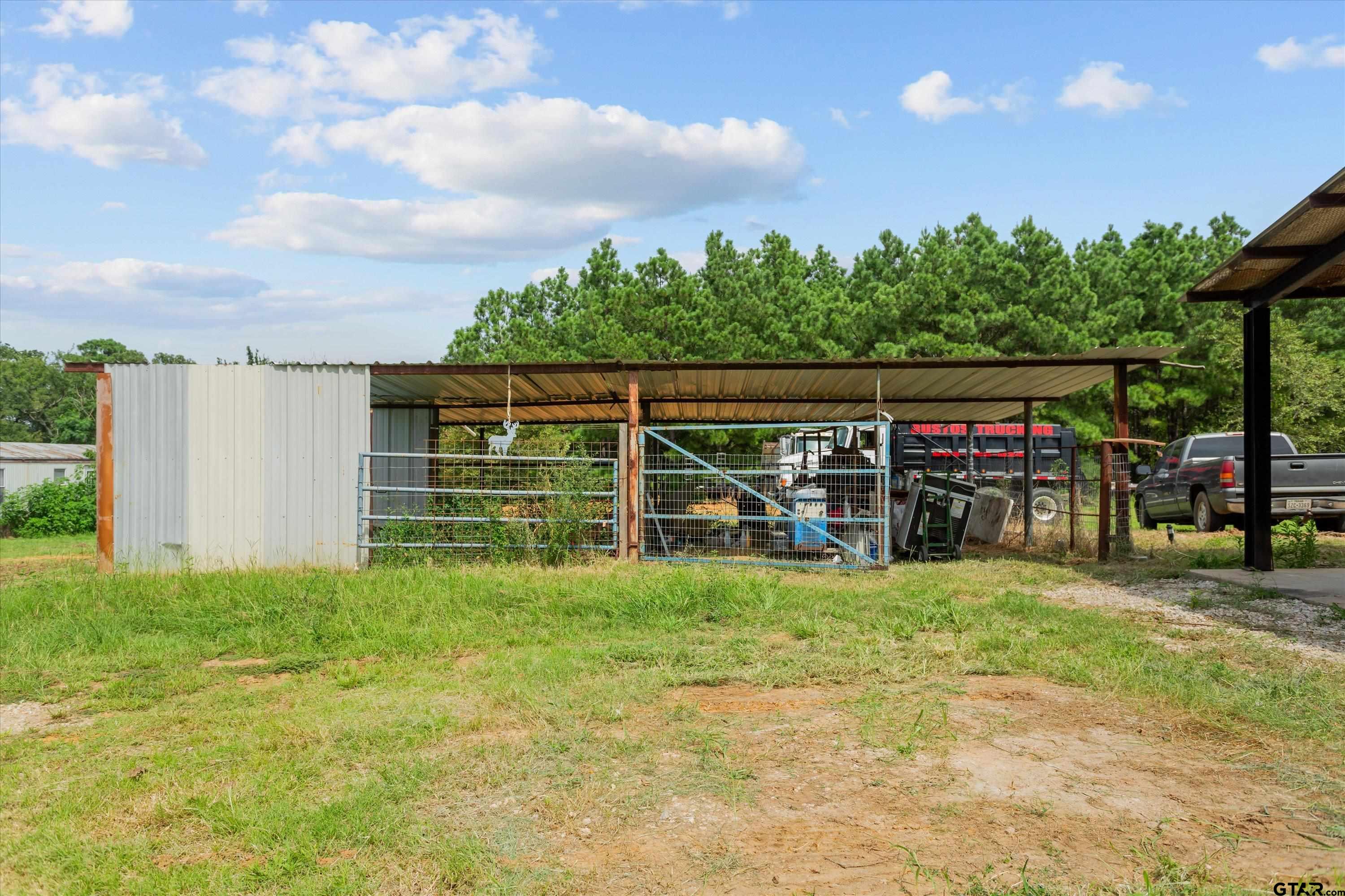9374 Cedarvale Drive Tyler, TX 75708 - Photo 19 of 20 a view of a house with yard and sitting area