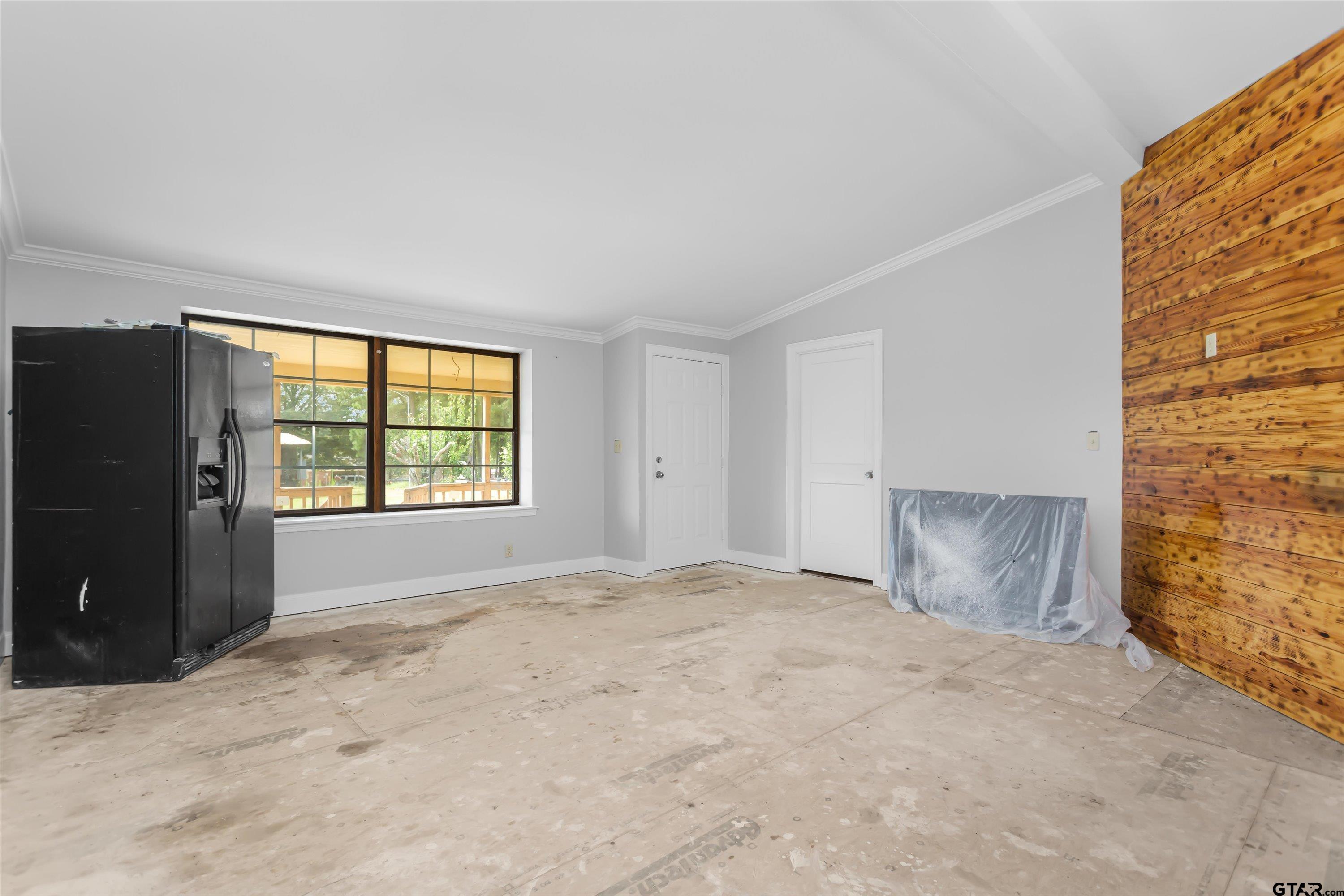 9374 Cedarvale Drive Tyler, TX 75708 - Photo 5 of 20 a view of an empty room with a window