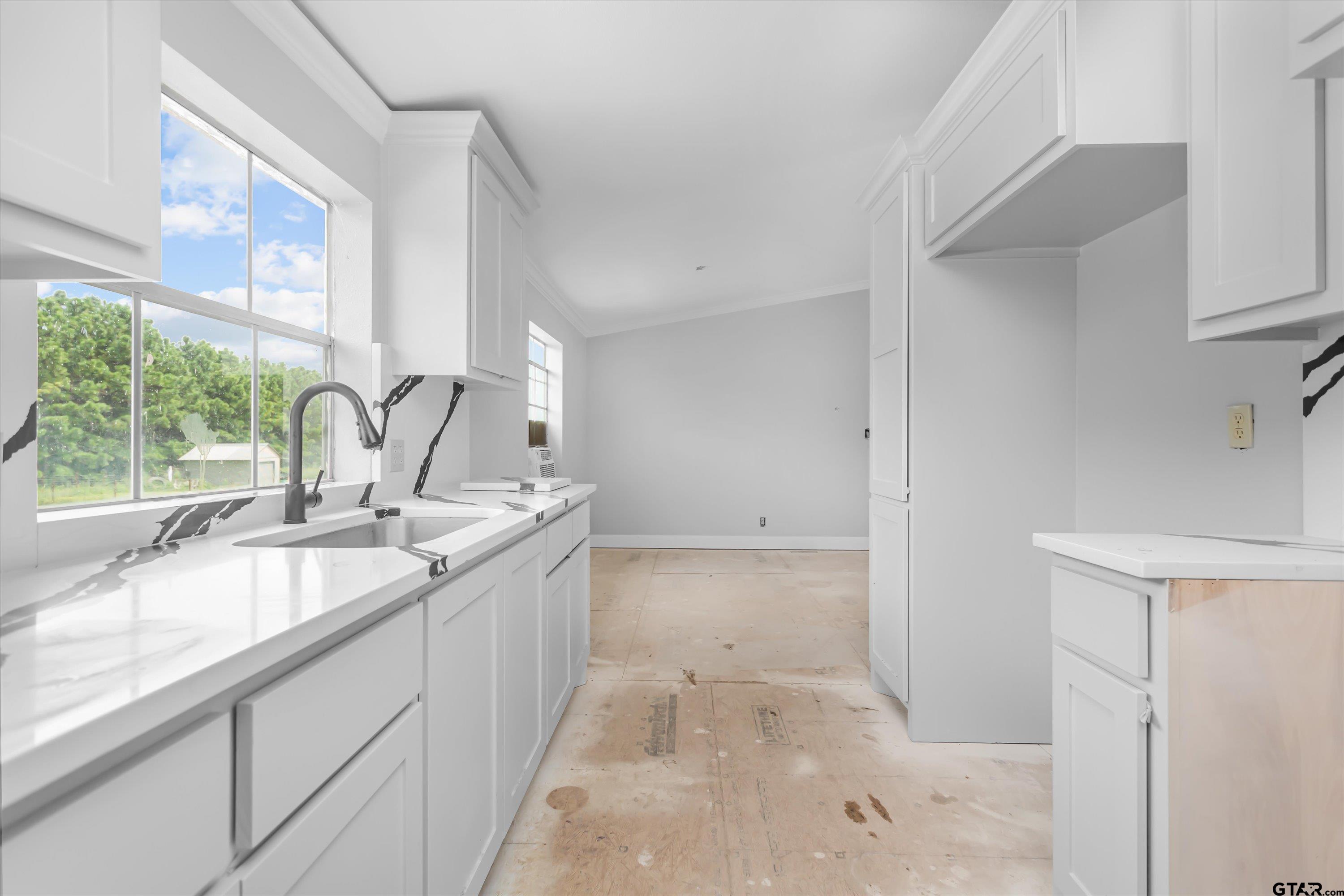 9374 Cedarvale Drive Tyler, TX 75708 - Photo 7 of 20 a kitchen with a sink and large window