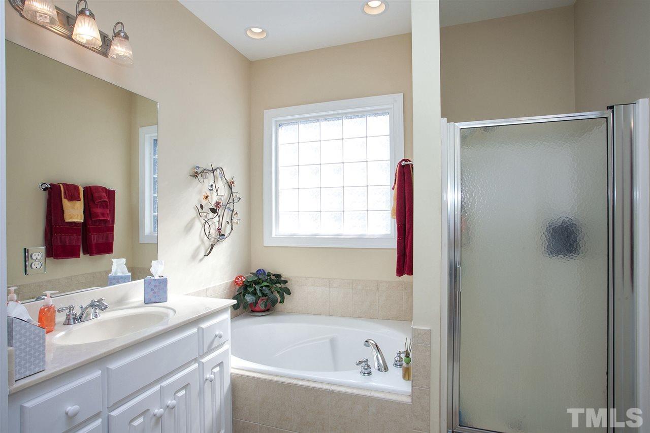 11551 Rockside Road Middlesex, NC 27557 - Photo 11 of 25 a bathroom with a bathtub and a sink