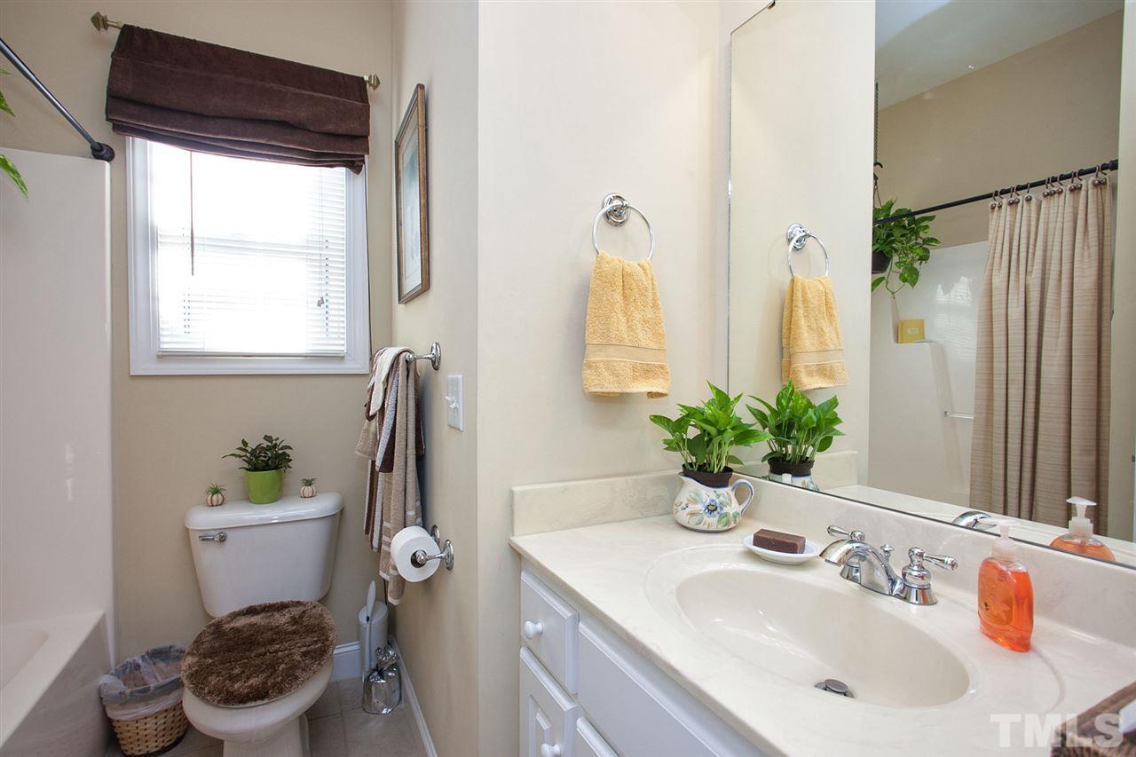 11551 Rockside Road Middlesex, NC 27557 - Photo 12 of 25 a bathroom with a sink a toilet and a mirror