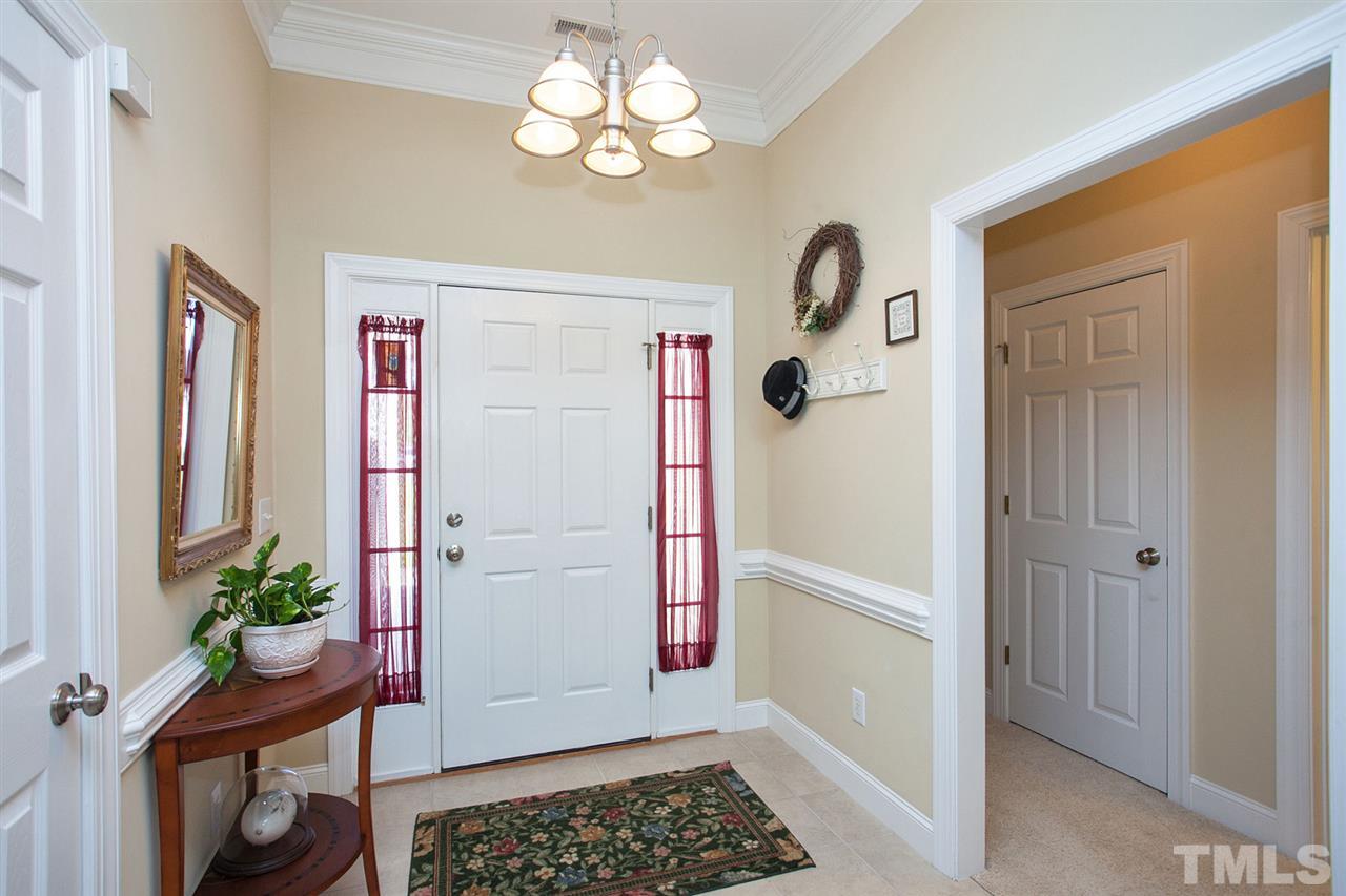 11551 Rockside Road Middlesex, NC 27557 - Photo 13 of 25 a view of a hallway to dining room and wooden floor
