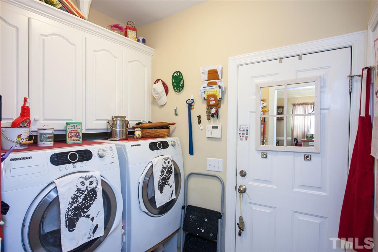 11551 Rockside Road Middlesex, NC 27557 - Photo 15 of 25 a view of storage and utility room with washer and dryer