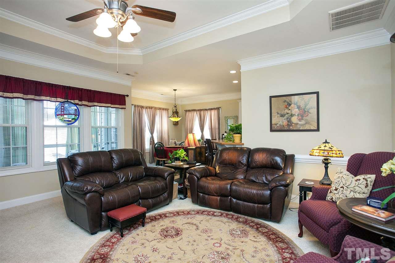 11551 Rockside Road Middlesex, NC 27557 - Photo 16 of 25 a living room with furniture ceiling fan and a rug