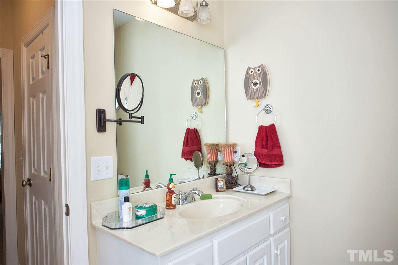 11551 Rockside Road Middlesex, NC 27557 - Photo 20 of 25 a bathroom with a sink mirror and vanity