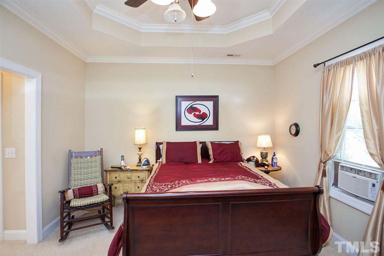 11551 Rockside Road Middlesex, NC 27557 - Photo 21 of 25 a bed room with a bed and a chair