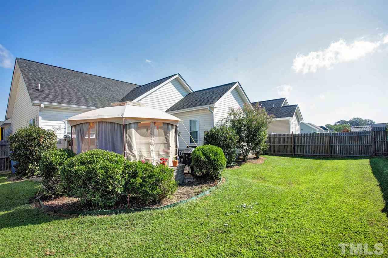 11551 Rockside Road Middlesex, NC 27557 - Photo 23 of 25 a front view of a house with a yard and garage