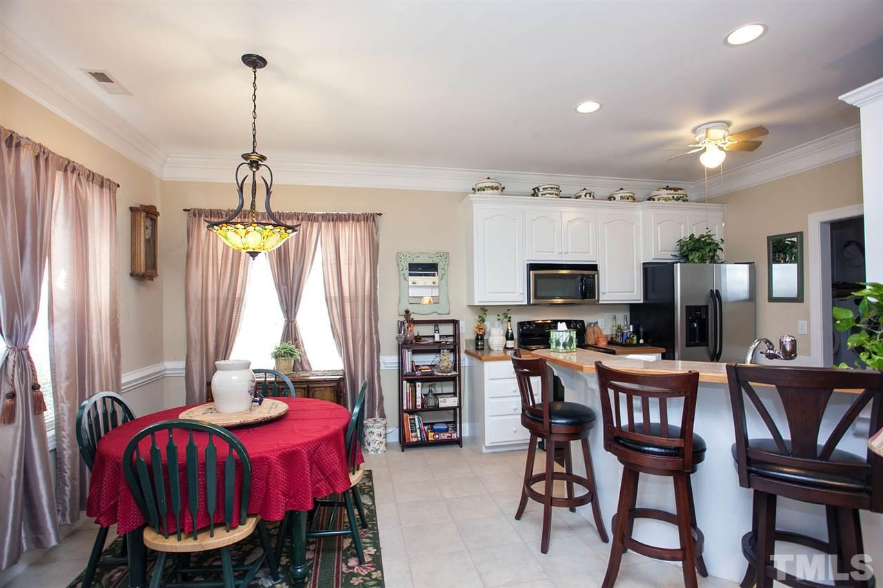 11551 Rockside Road Middlesex, NC 27557 - Photo 5 of 25 a view of a dining room with furniture window and wooden floor