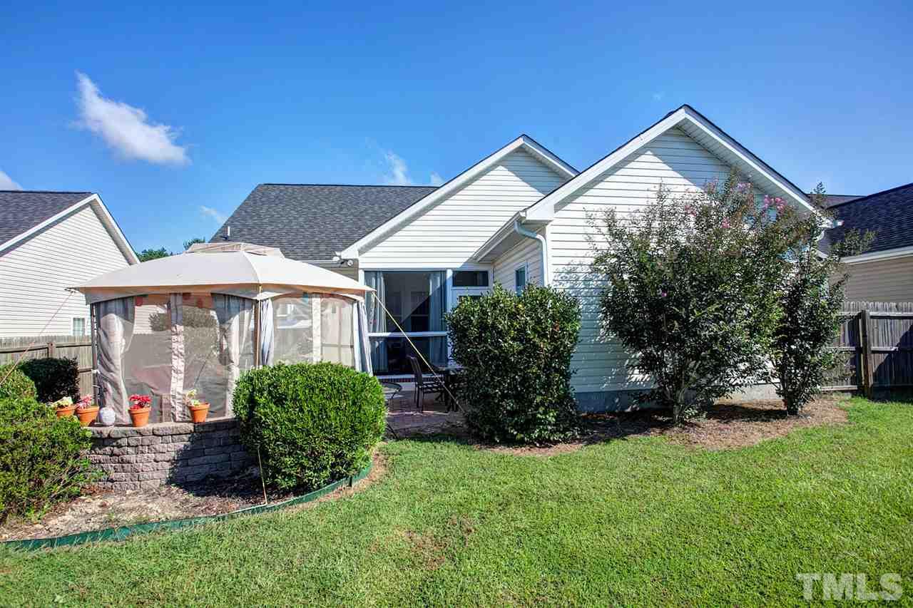 11551 Rockside Road Middlesex, NC 27557 - Photo 10 of 25 a front view of a house with a yard and porch