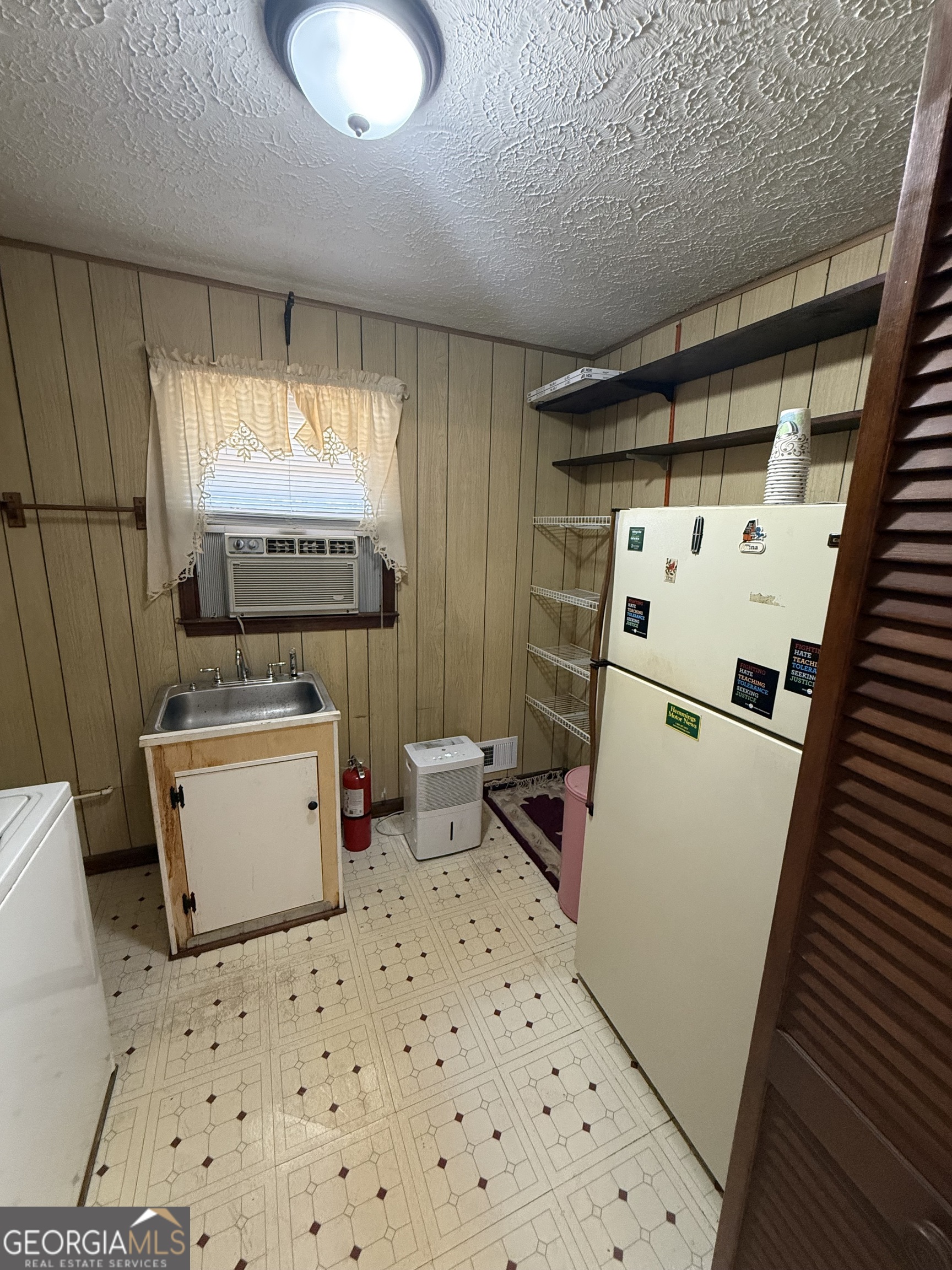 110 Otelia Lane Covington, GA 30014 - Photo 20 of 30 a room with storage and utility