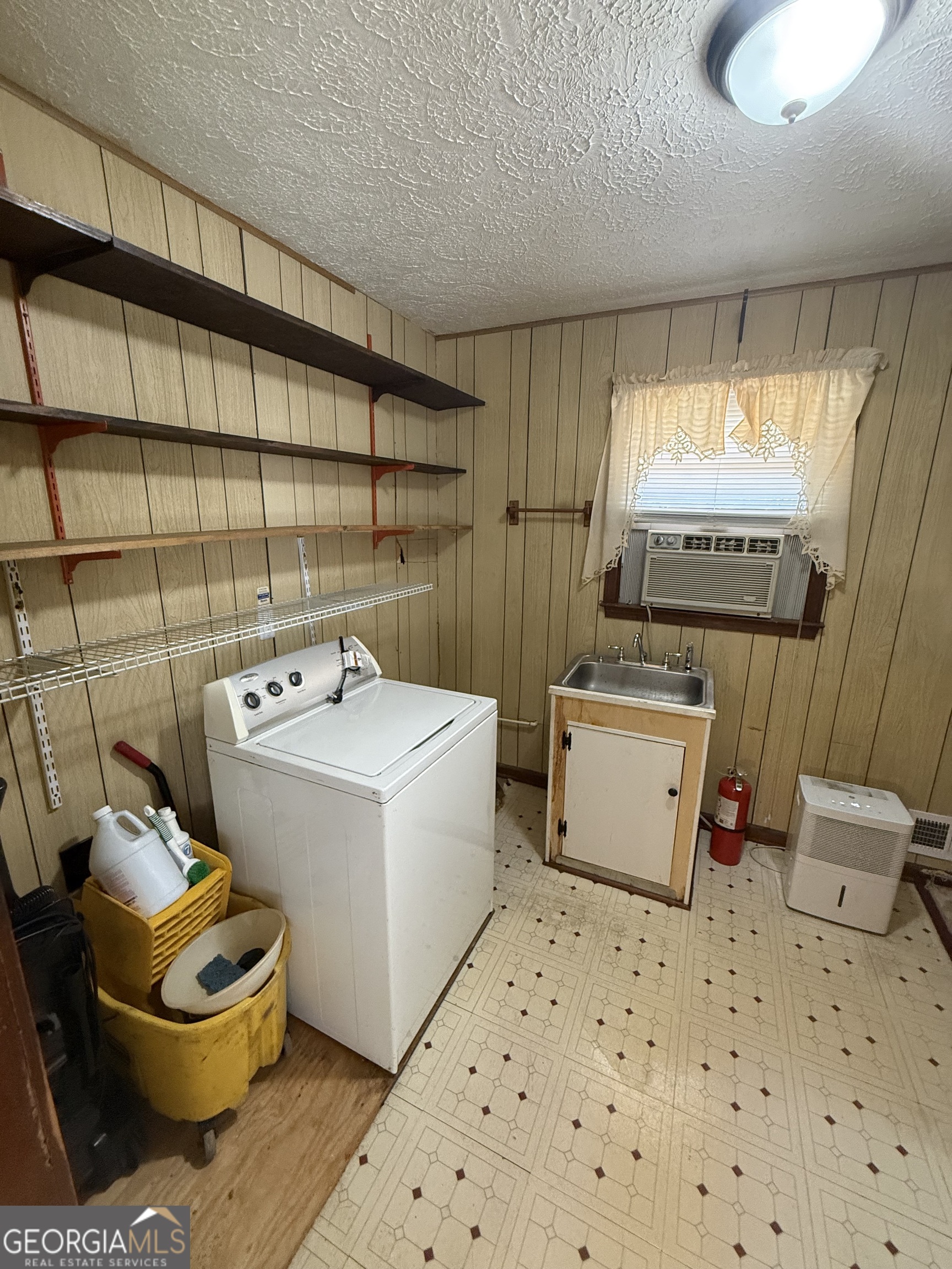 110 Otelia Lane Covington, GA 30014 - Photo 21 of 30 a utility room with a window