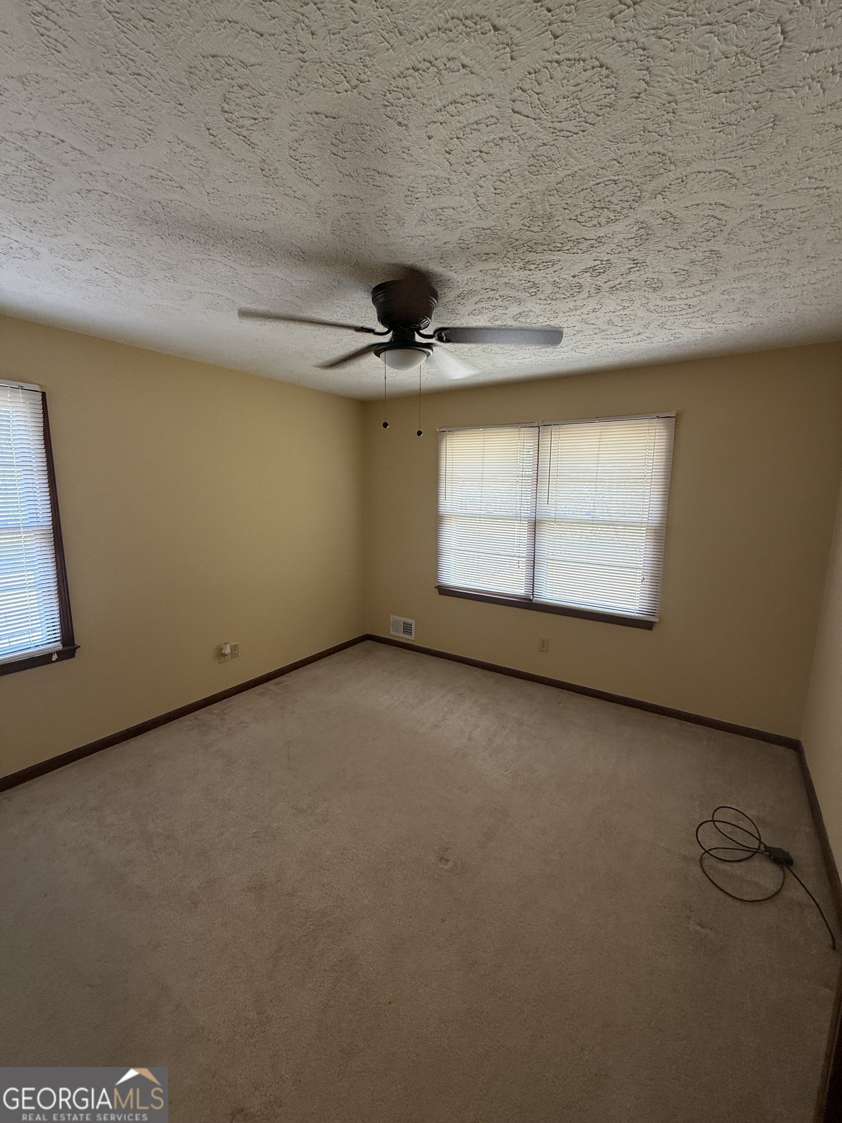 110 Otelia Lane Covington, GA 30014 - Photo 27 of 30 a view of a livingroom with an empty space and window