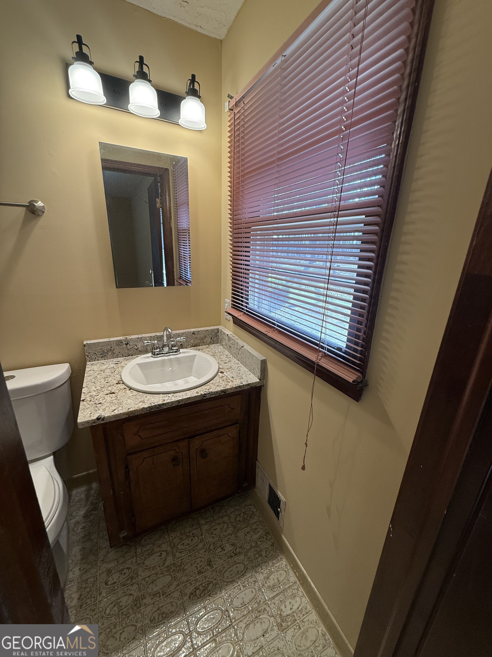 110 Otelia Lane Covington, GA 30014 - Photo 29 of 30 a bathroom with a sink and a mirror