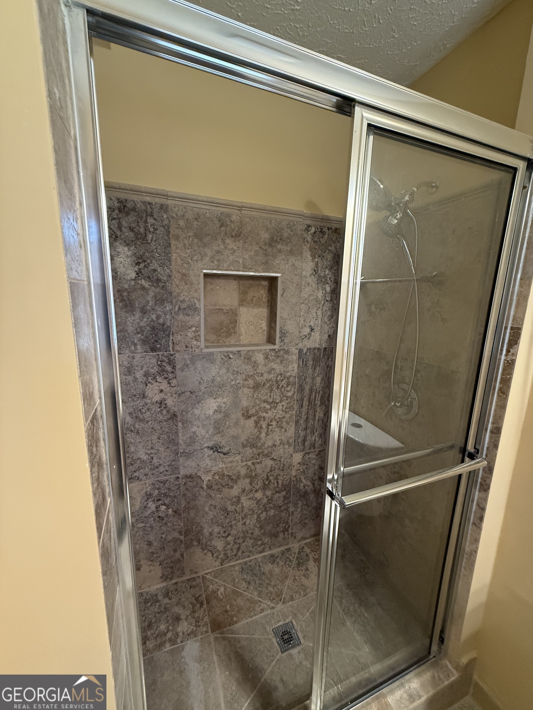 110 Otelia Lane Covington, GA 30014 - Photo 30 of 30 a bathroom with a glass shower door