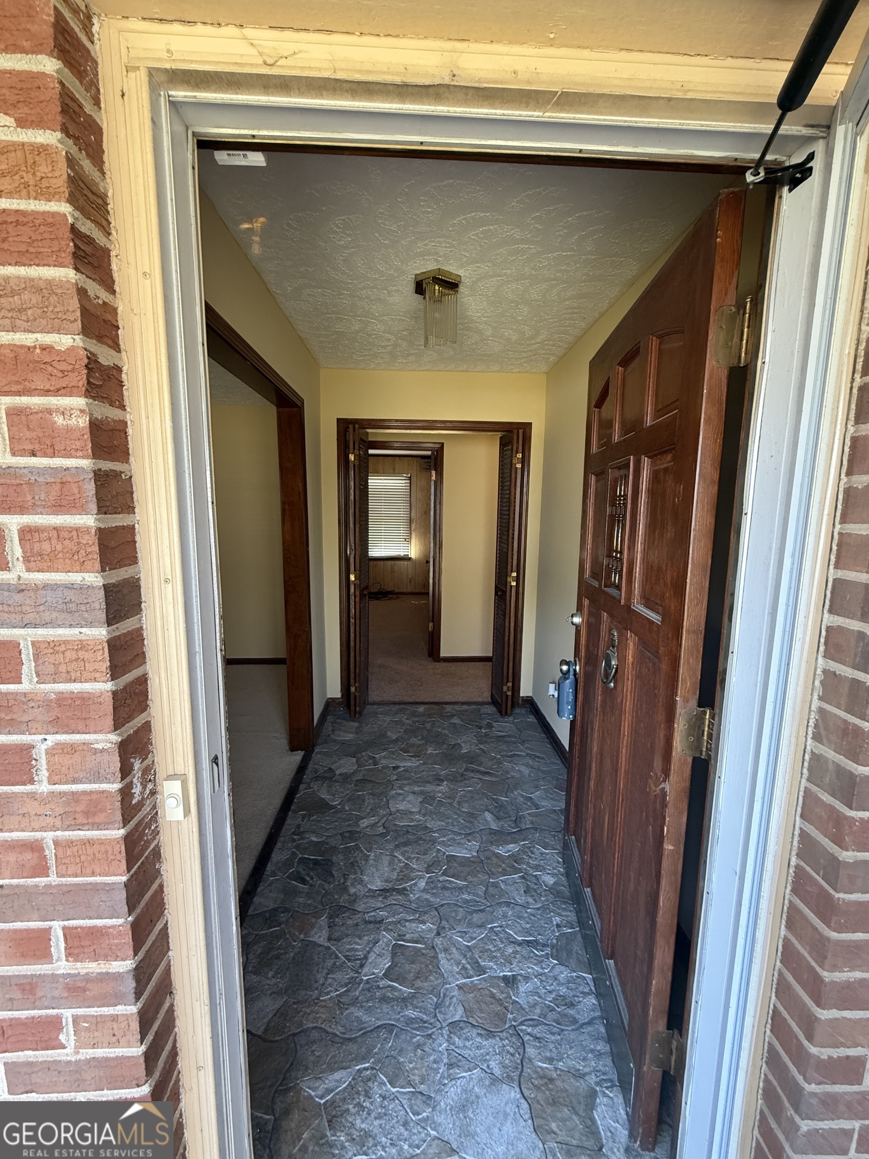 110 Otelia Lane Covington, GA 30014 - Photo 6 of 30 a view of hallway with window and stairs