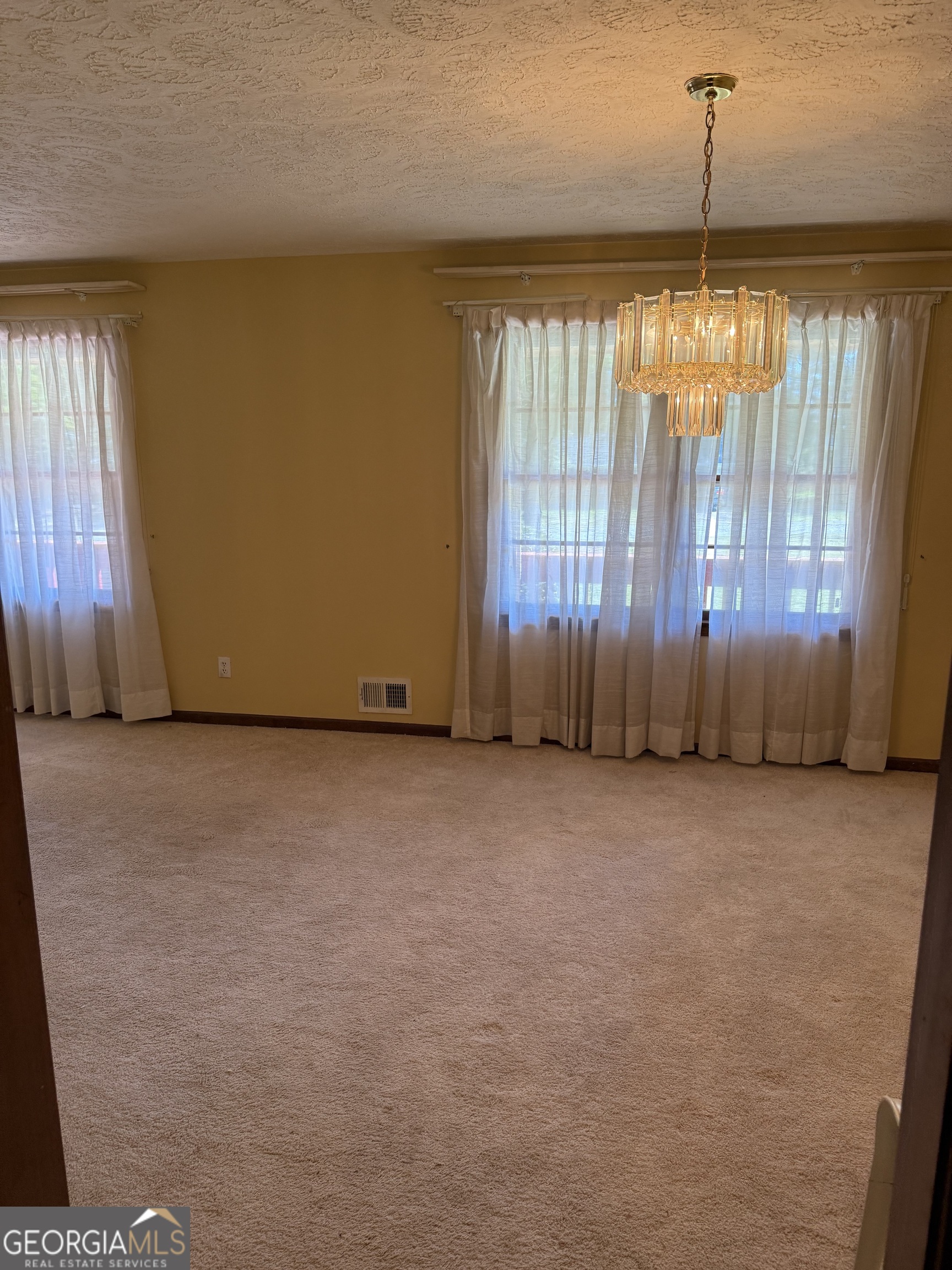 110 Otelia Lane Covington, GA 30014 - Photo 8 of 9 a view of an empty room with a window