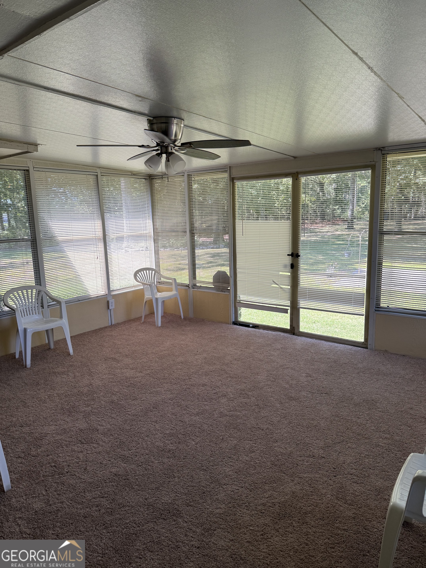 110 Otelia Lane Covington, GA 30014 - Photo 9 of 9 a view of a big room with windows and chandelier