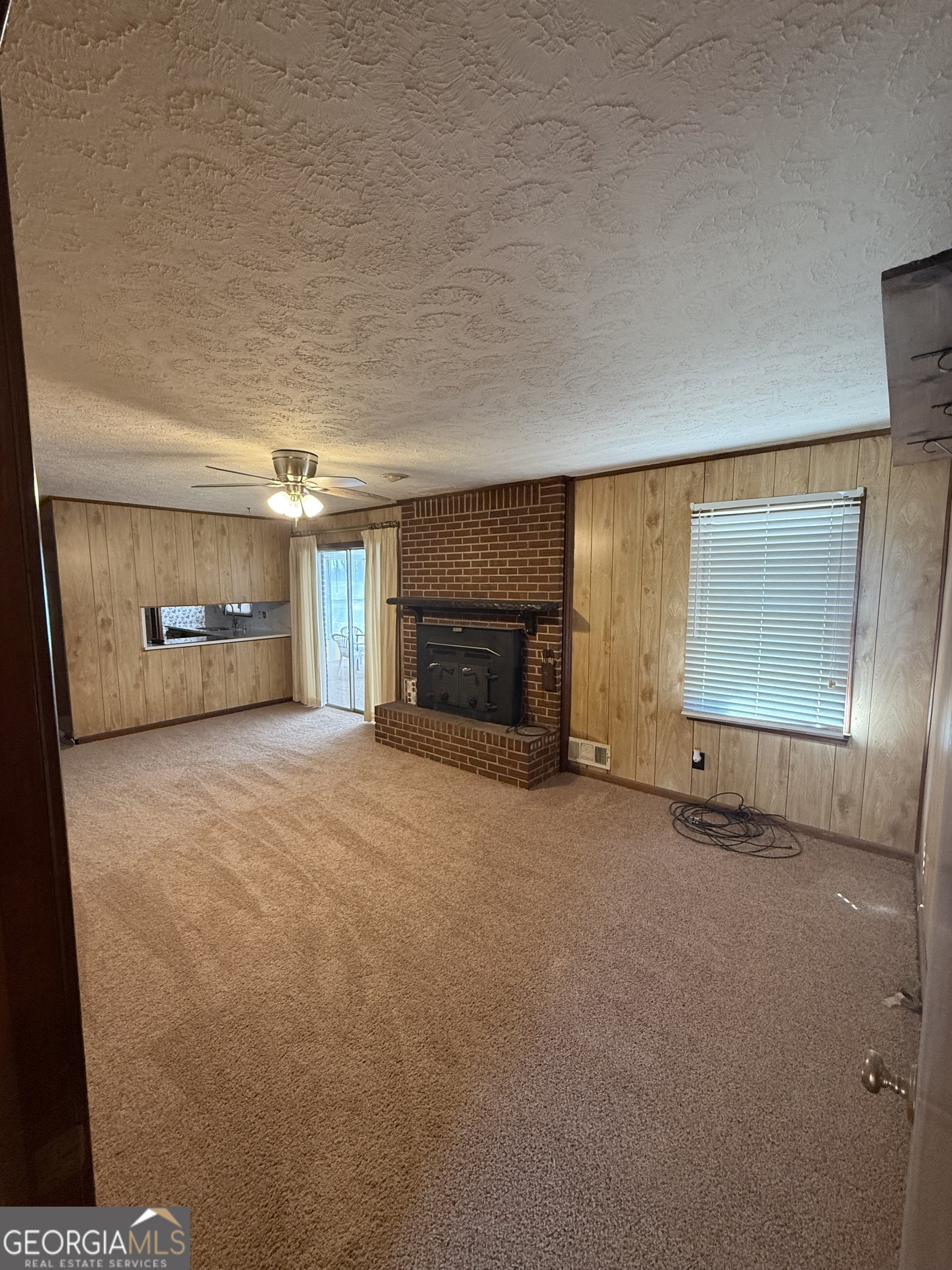 110 Otelia Lane Covington, GA 30014 - Photo 10 of 30 a view of empty room with a fireplace