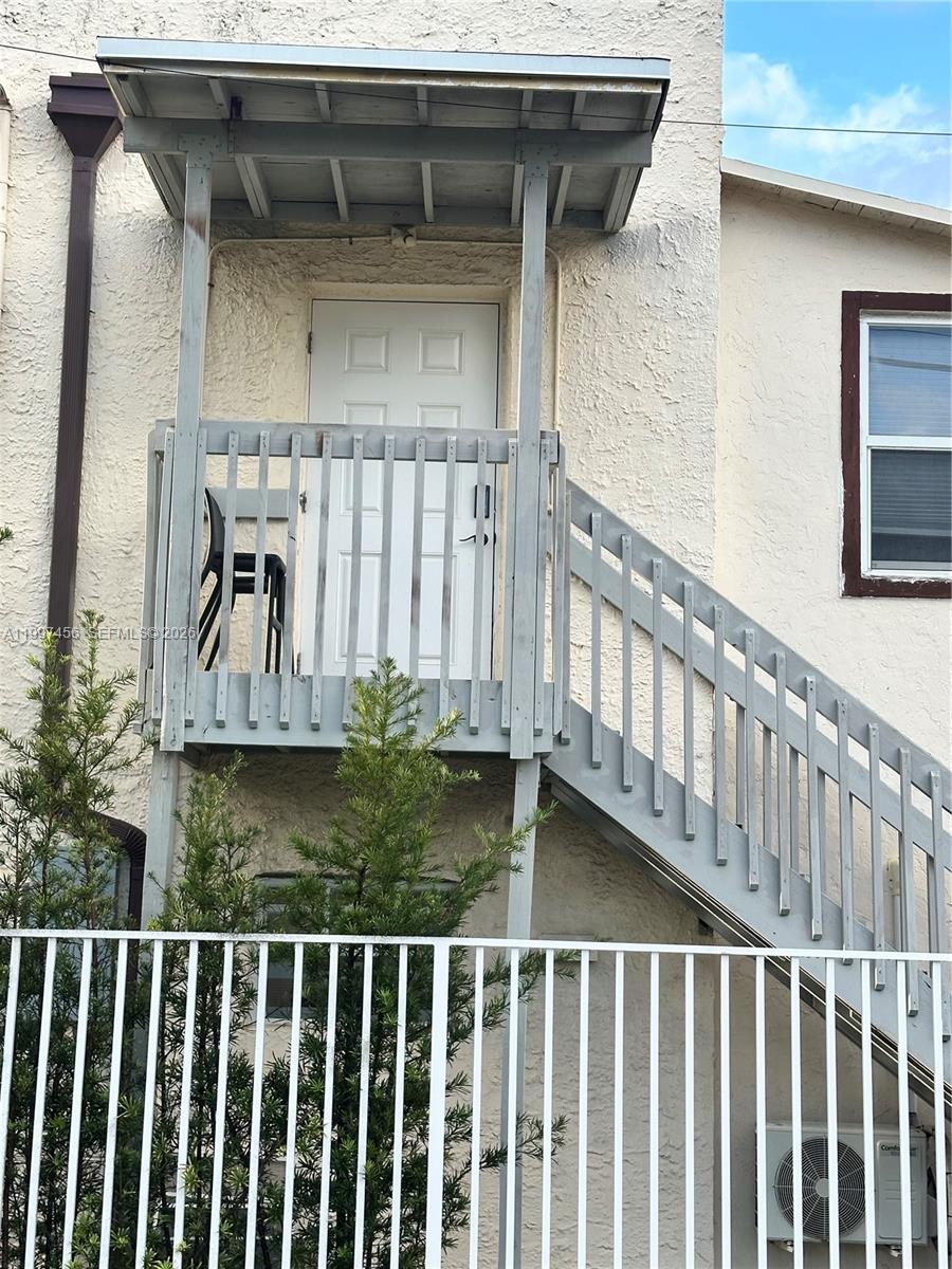2160 Southwest 17th Street, Unit 2162 Miami, FL 33145 - Photo 4 of 28 a balcony with wooden floor in front of it