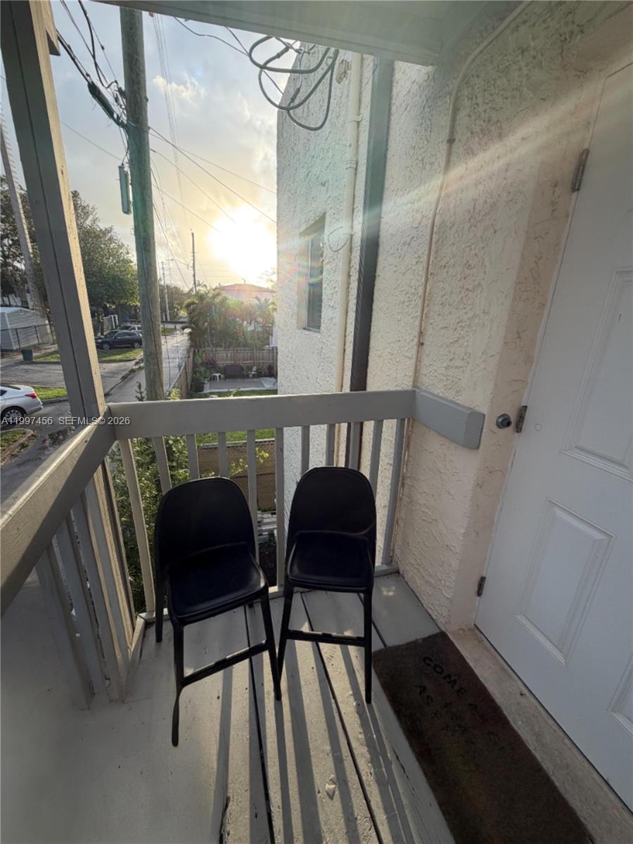 2160 Southwest 17th Street, Unit 2162 Miami, FL 33145 - Photo 5 of 28 a view of a chair and table in the balcony