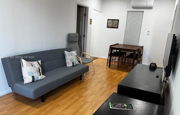 2160 Southwest 17th Street, Unit 2162 Miami, FL 33145 - Photo 7 of 28 a living room with furniture and a flat screen tv