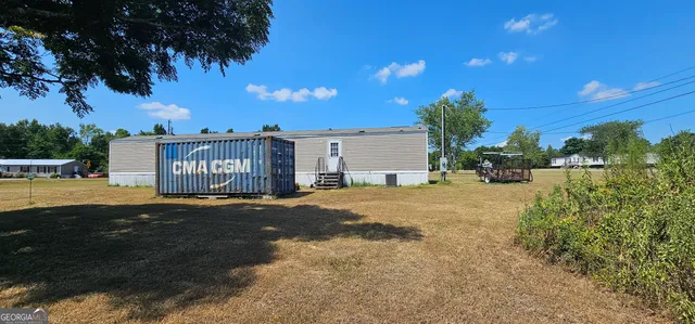 a sign board with yard