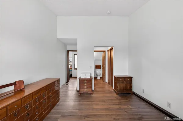 a view of an empty room and wooden floor