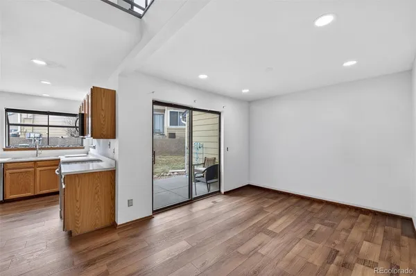 a view of kitchen with stainless steel appliances granite countertop refrigerator sink and stove