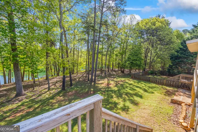a kitchen with stainless steel appliances granite countertop a stove sink microwave and cabinets
