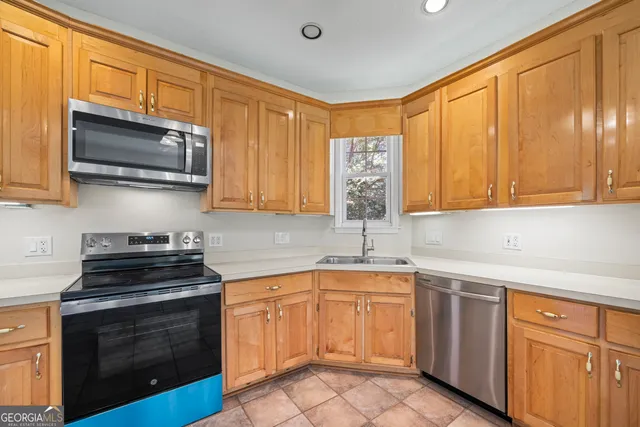 a bathroom with a sink a mirror and a shower
