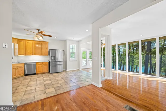 a en suite bathroom with a granite countertop sink and a mirror