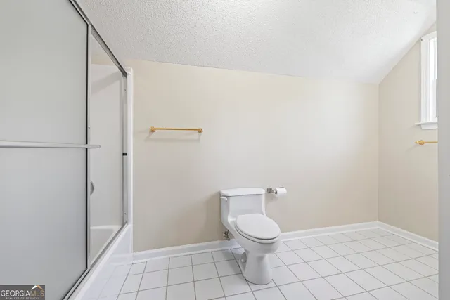 a view of a hallway with stairs