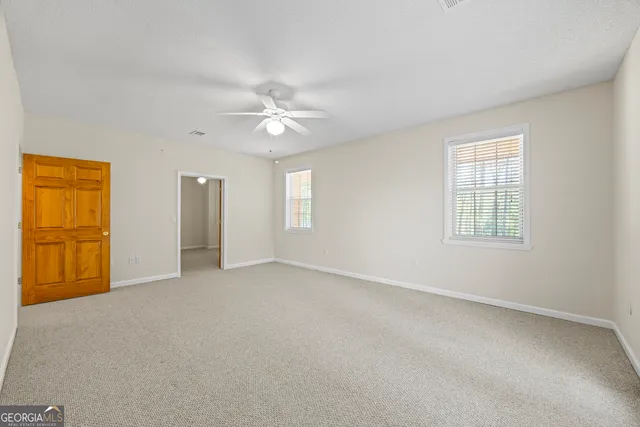 a view of a balcony with wooden floor and fence