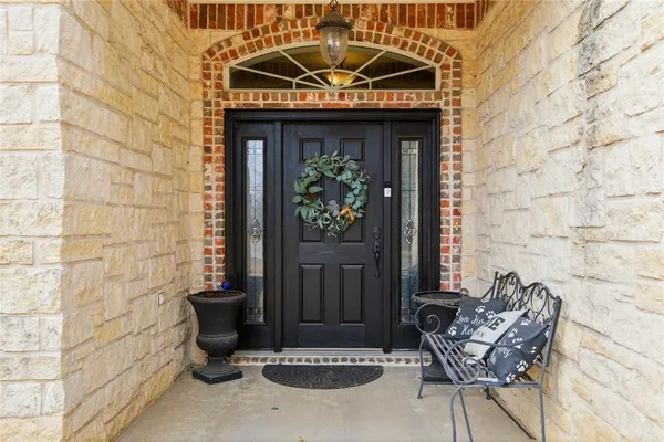 a front view of a house with outdoor seating