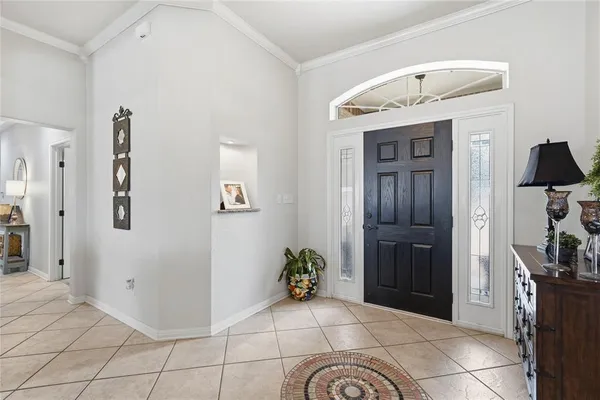 a spacious bedroom with a bed and a cabinets