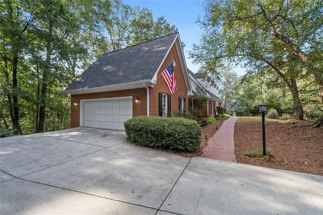 a view of wooden floor and windows in a room