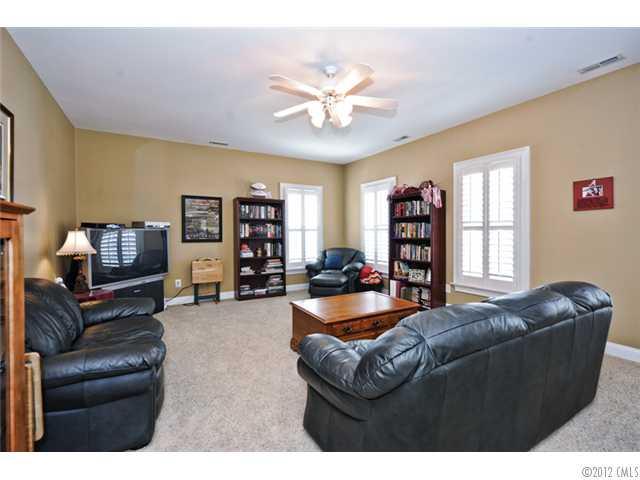 419 Bull Finch Bend Fort Mill, SC 29708 - Photo 13 of 16 a living room with fireplace furniture and a window