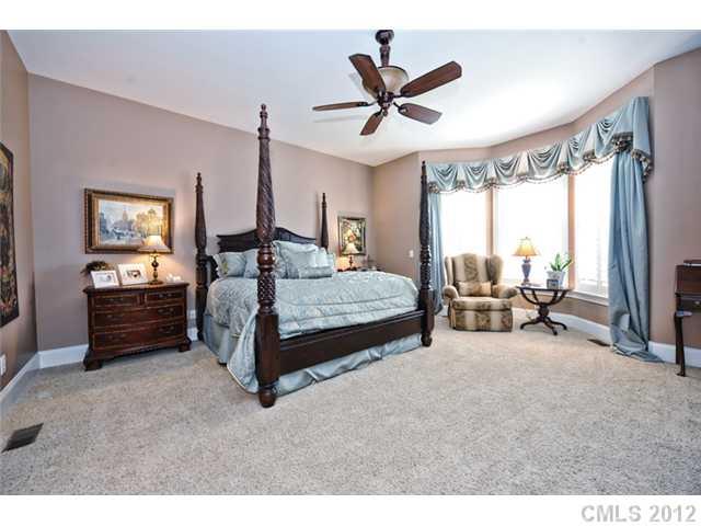419 Bull Finch Bend Fort Mill, SC 29708 - Photo 8 of 16 a bedroom with furniture and a large window