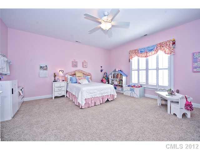 419 Bull Finch Bend Fort Mill, SC 29708 - Photo 10 of 16 a bedroom with a bed and a large window