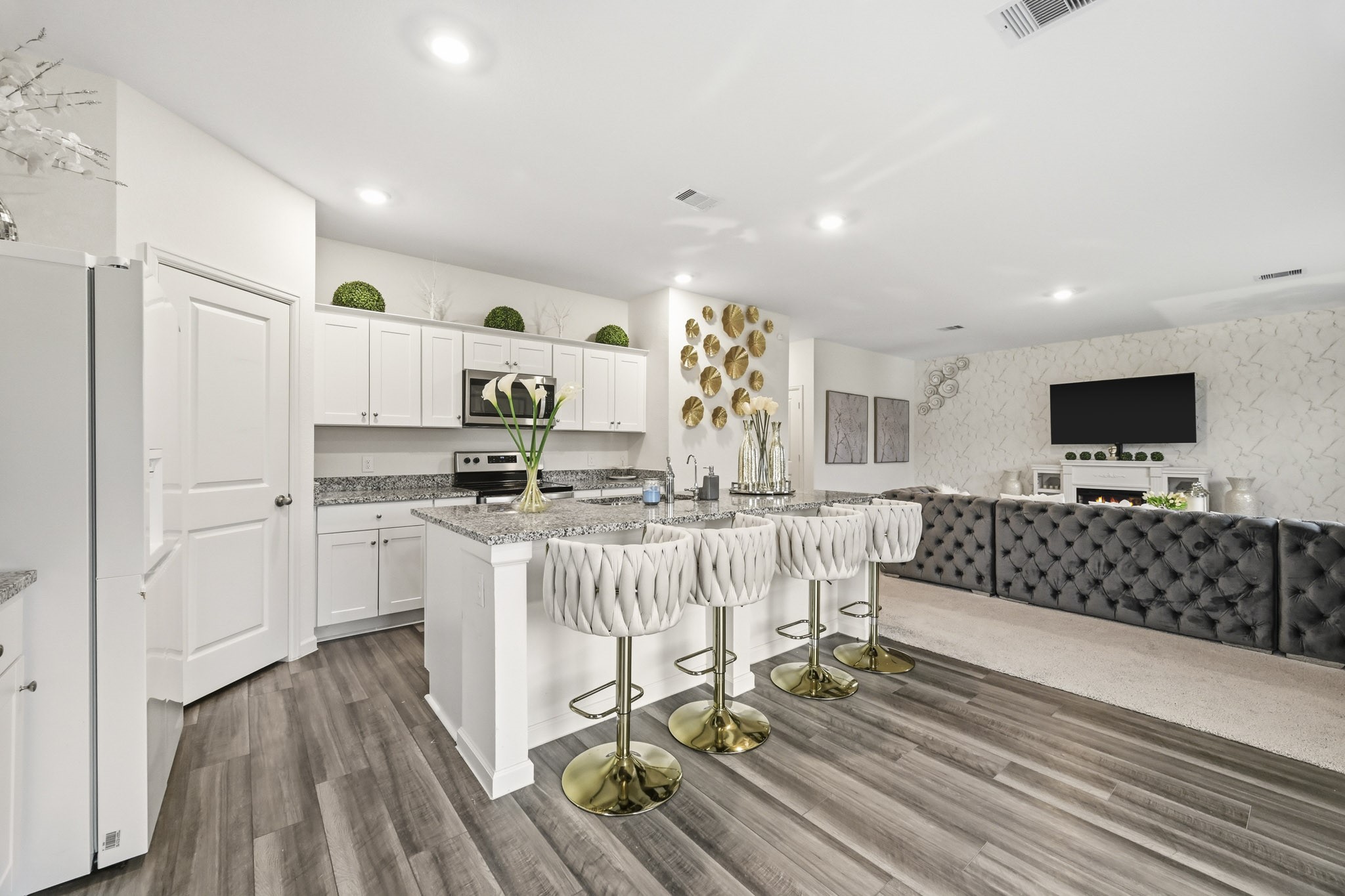 7207 Evitale Way Houston, TX 77049 - Photo 11 of 43 a kitchen with stainless steel appliances kitchen island granite countertop a refrigerator and microwave