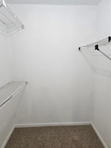 a bathroom with a sink and mirror with bathtub