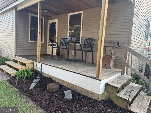 a view of a house with sitting area and furniture