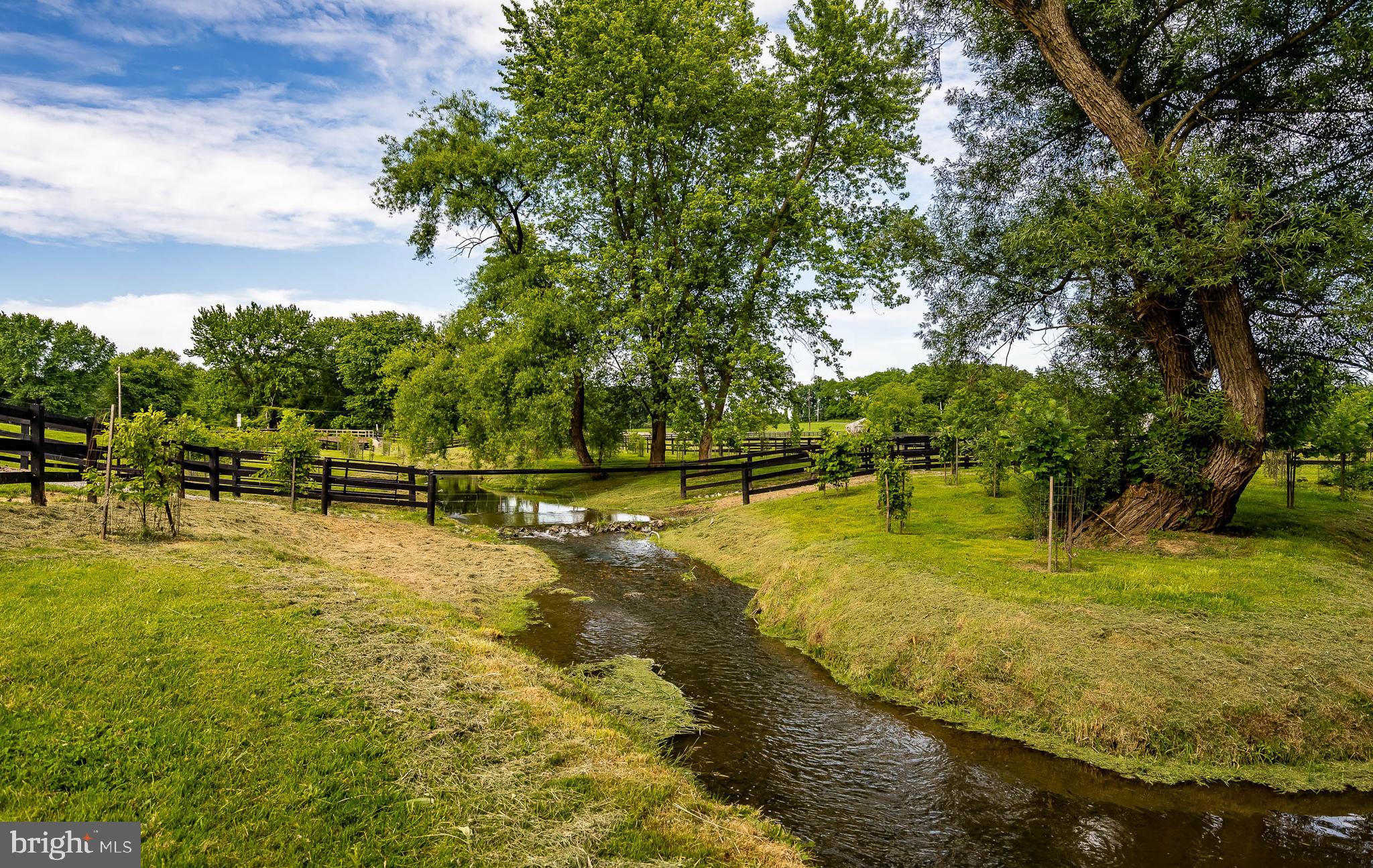 580 Woodview Road Avondale, PA 19311 - Photo 39 of 48 Stream through pastures
