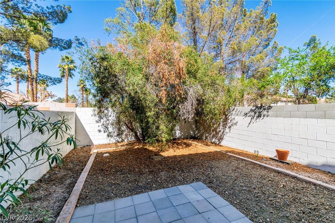 6250 West Flamingo Road, Unit 98 Las Vegas, NV 89103 - Photo 36 of 40 View of yard with a fenced backyard