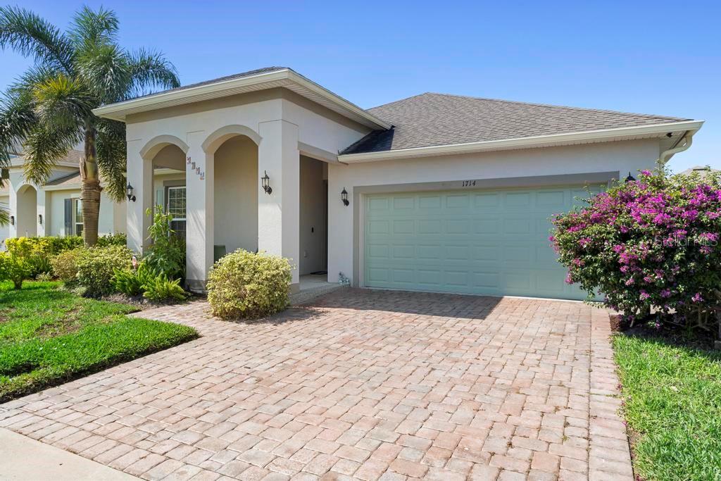 1714 Leatherback Lane St. Cloud, FL 34771 - Photo 1 of 1 a front view of a house with a yard