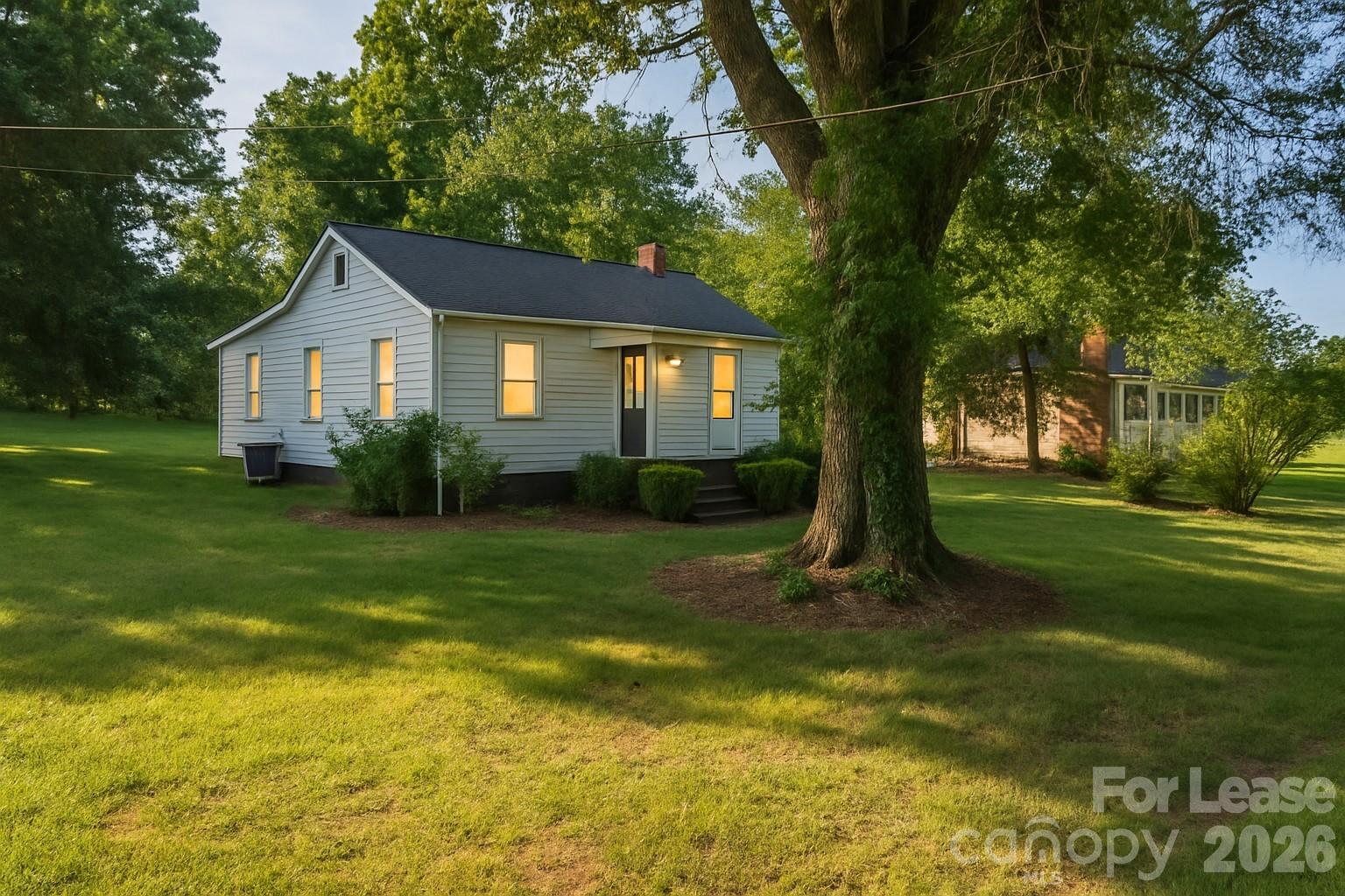 116 Barnes Lane Stony Point, NC 28678 - Photo 1 of 40 a view of a house with a big yard plants and large trees