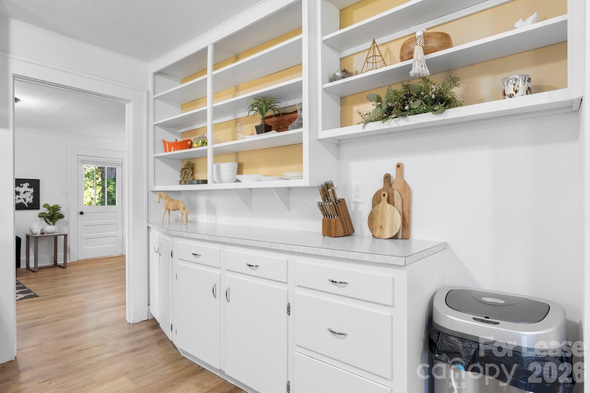 116 Barnes Lane Stony Point, NC 28678 - Photo 12 of 40 a kitchen with a cabinets and wooden floor
