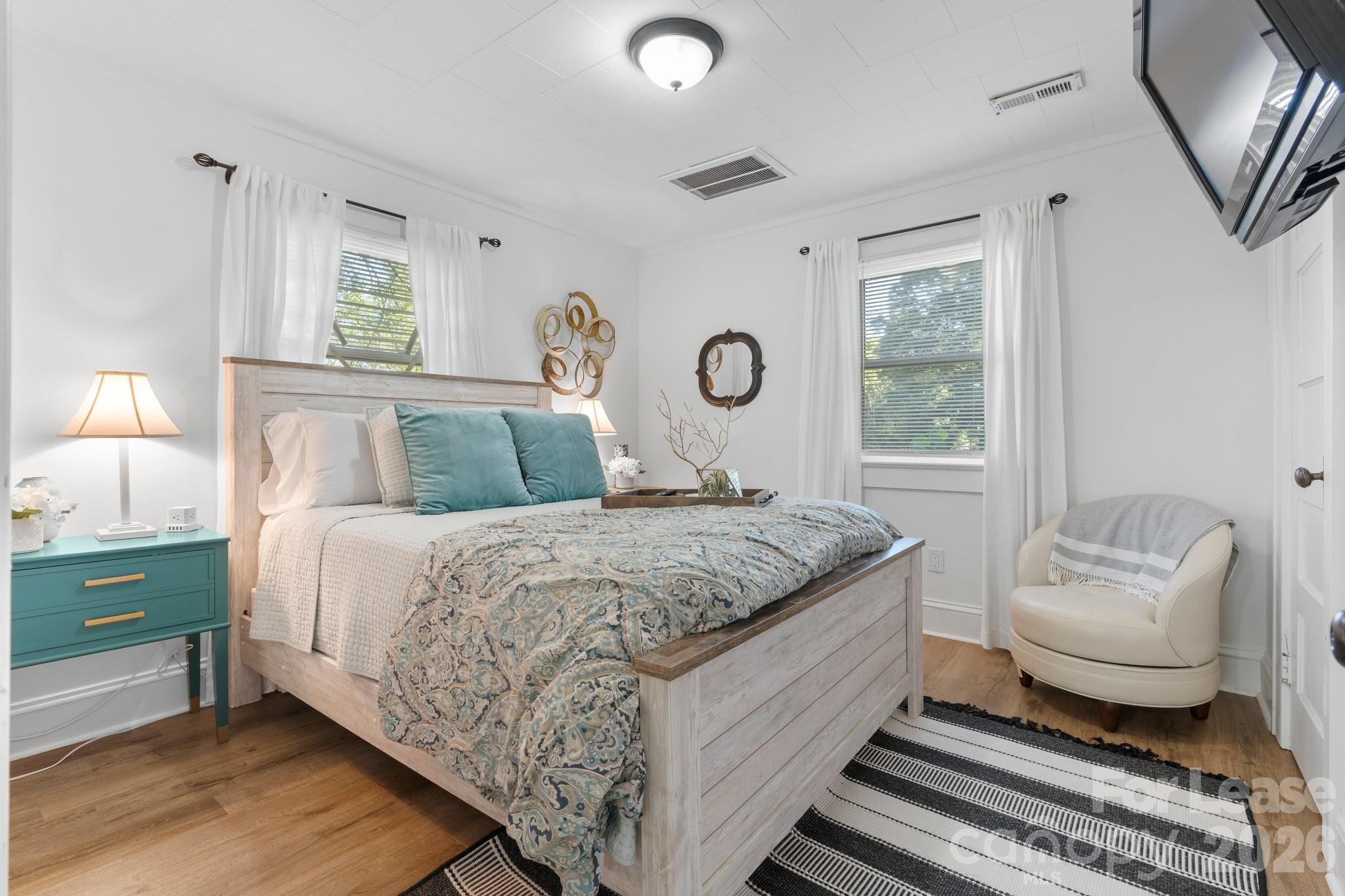 116 Barnes Lane Stony Point, NC 28678 - Photo 17 of 40 a bedroom with a bed and wooden floor